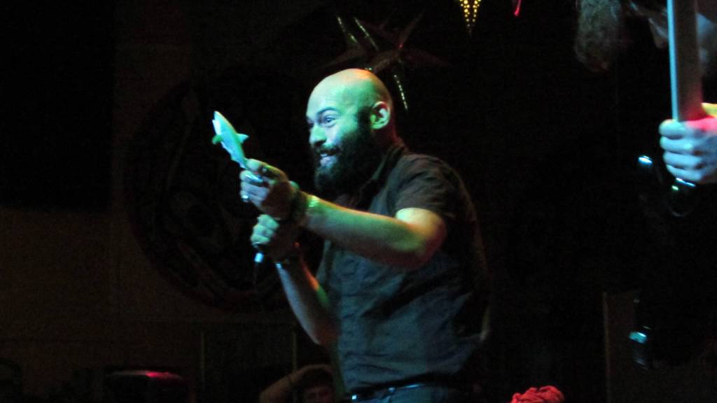 Seth Santana, vocalist for Before Youre Nothing, holds up a plastic shark during the Fall Freakshow metal concert at the JACC. The toy shortly thereafter was tossed into the audience. (Ben Hohenstatt | Capital City Weekly)