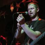 Trevyn Days of Distance Defined adjusts Trevyn Days adjusts his wristband while talking to the audience during the Fall Freakshow concert. Distance Defined is a metalcore band from Anchorage that includes brothers Trevyn and Trentyn Days from Juneau.