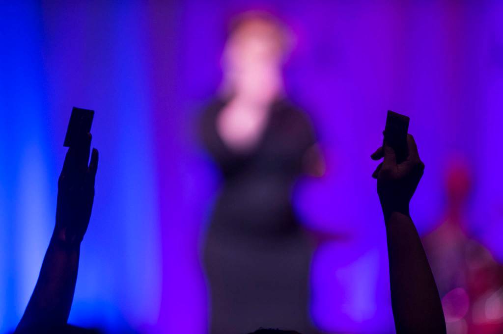 Audience members hold up money as they vote of contestants at Juneau Lyric Operas production of Whos Your Diva? at Centennial Hall on Saturday, Sept. 29, 2018. (Michael Penn | Juneau Empire)