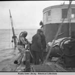 Diver and workers on boat above sunken Princess Sophia, 1918. (Alaska State Library Historical Collection, ASL-P87-1710)