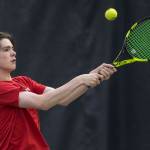 William Smoker, a junior at Juneau-Douglas High School, returns a backhand during the Regional Tennis Championships at JRC/The Alaska Club on Sunday, Sept. 23, 2018. Smoker won titles placed first in singles, doubles and mixed doubles. (Michael Penn | Juneau Empire)