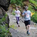 Steve Morley leads Maisy Morley down Perseverance Trail during the Perseverance Trail Run/Ben Blackgoat Memorial on Saturday, June 16, 2018. (Nolin Ainsworth | Juneau Empire)