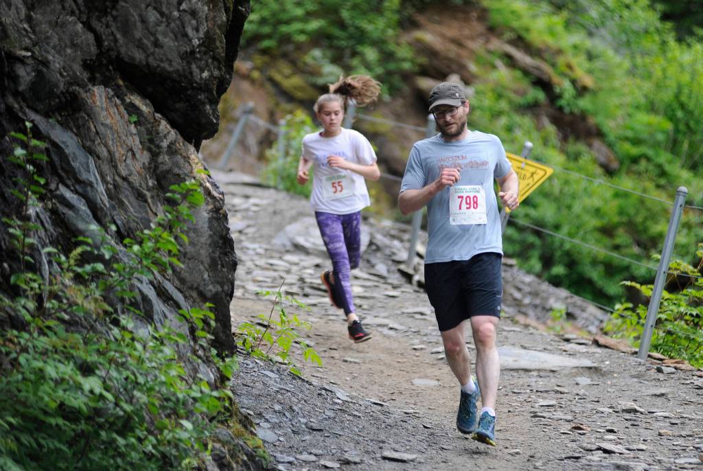 Steve Morley leads Maisy Morley down Perseverance Trail during the Perseverance Trail Run/Ben Blackgoat Memorial on Saturday, June 16, 2018. (Nolin Ainsworth | Juneau Empire)