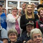 Mayoral candidate Beth Weldon, with family and friends, react as they watch Election results come in at the Assembly chambers on Tuesday, Oct. 2, 2018. (Michael Penn | Juneau Empire)