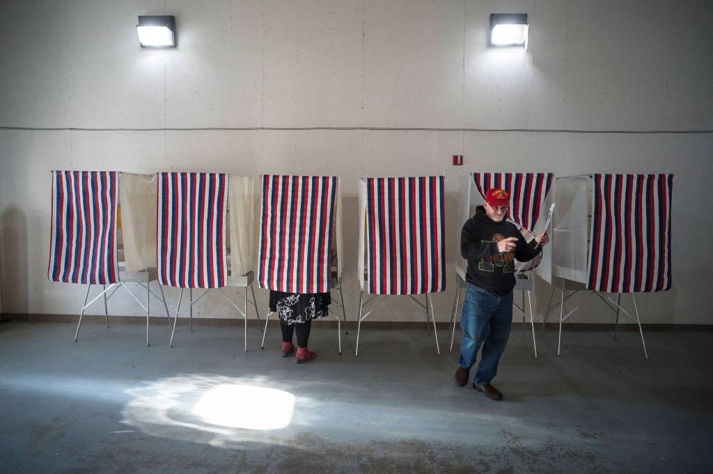 Michael Boisvert exits a voting booth in the Municipal Election at AEL&P on Tuesday, Oct. 2, 2018. (Michael Penn | Juneau Empire)