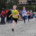 Dzantiki Heeni Middle School eighth grader Finn Kesey sprints to the finish line of the Treadwell Middle School Cross Country Meet on Thursday at Savikko Park on Douglas. (Nolin Ainsworth | Juneau Empire)