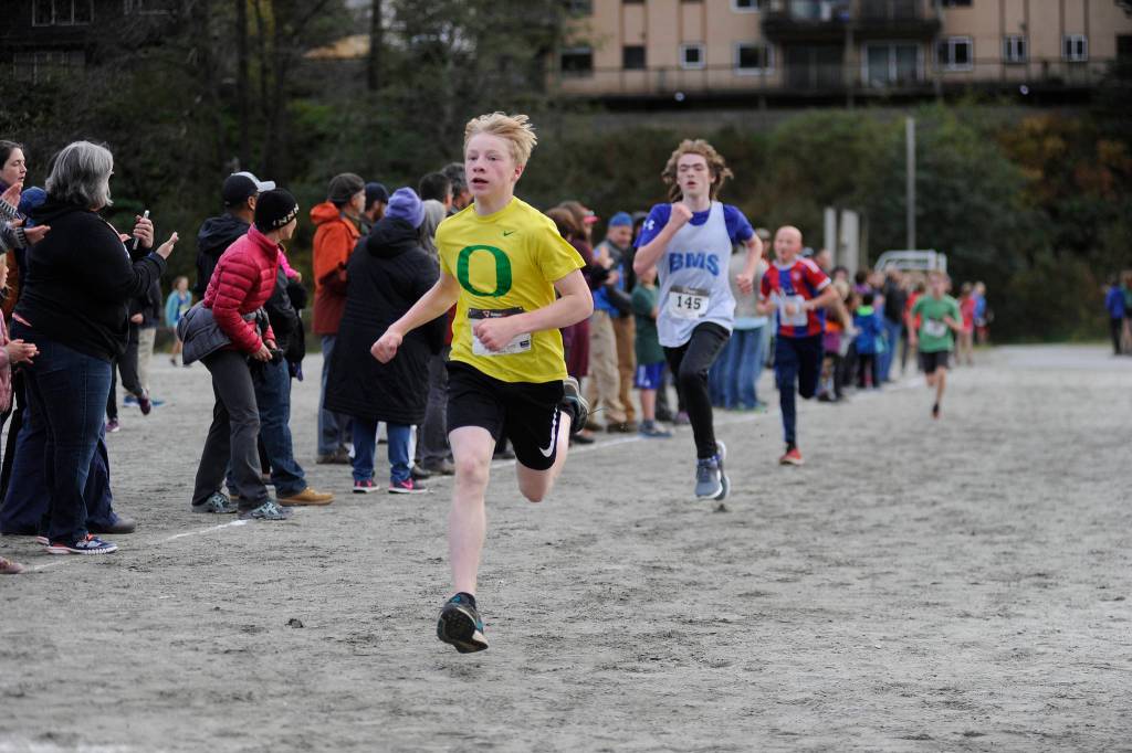 Dzantiki Heeni Middle School eighth grader Finn Kesey sprints to the finish line of the Treadwell Middle School Cross Country Meet on Thursday at Savikko Park on Douglas. (Nolin Ainsworth | Juneau Empire)