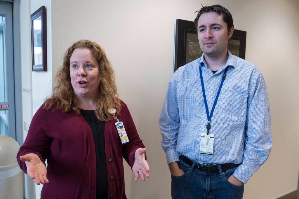 Meagan Hinton, left, an instructor of Project SEARCH, and Jason Bushman, HR specialist, talk about Bartlett Regional Hospitals internship for young people with disabilities on Friday, Oct. 5, 2018. (Michael Penn | Juneau Empire)