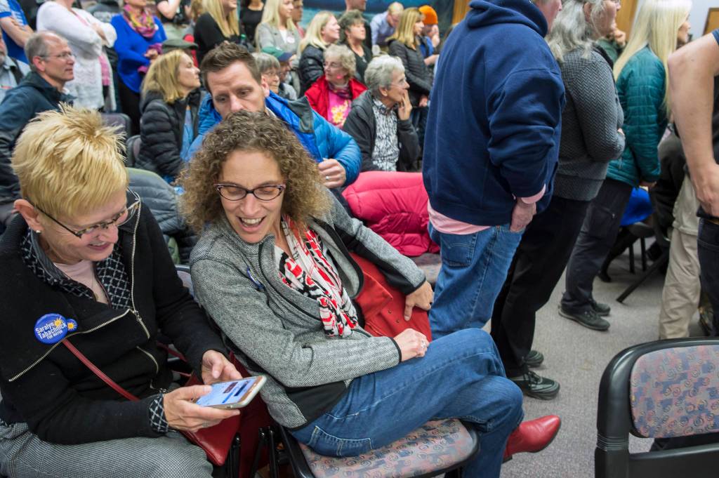 Mayoral candidate Saralyn Tabachnick, right, watches Election results at the Assembly chambers on Tuesday, Oct. 2, 2018. (Michael Penn | Juneau Empire)