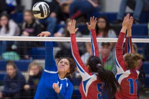 Thunder Mountains Letasiilemilion Fenumiai, left, hits against Sitkas Joei Vidad, center, and Abby Forrester at Thunder Mountain High School on Friday, Sept. 7, 2018. Thunder Mountain won 3-0 (25-15, 25-21, 25-16) (Michael Penn | Juneau Empire)