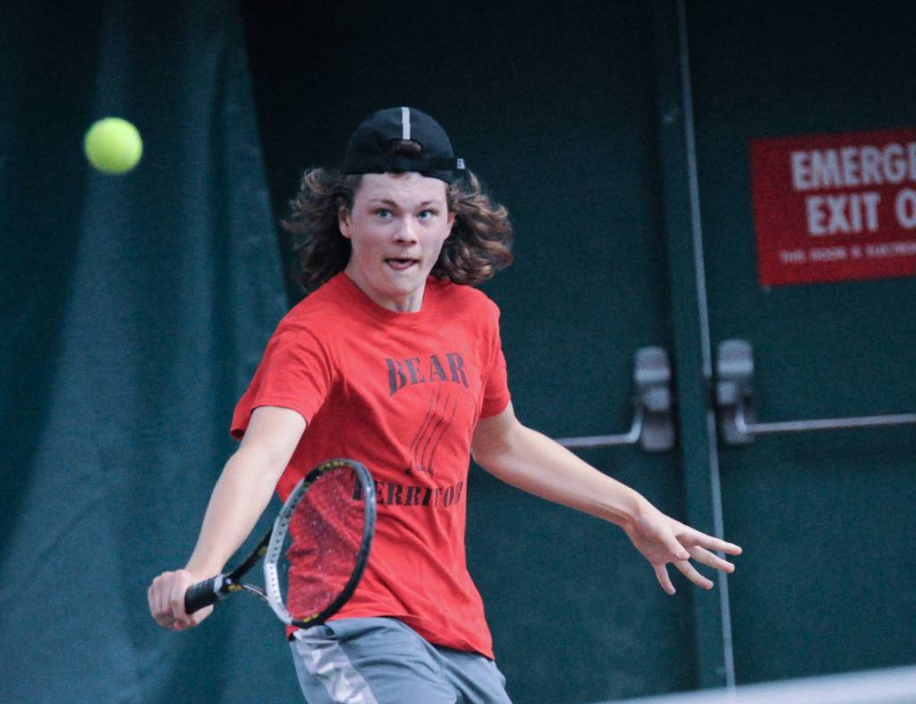 Wolf Dostal returns a shot against East Anchorages David Columbus in the first round of the ASAA/First National Bank Alaska State Tennis Championships at the Alaska Club East in Anchorage on Friday, Oct. 5, 2018. Dostal lost 6-1, 6-0. (Michael Dinneen | For the Juneau Empire)