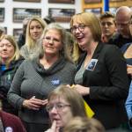 Assembly District 2 candidate Michelle Bonnet Hale, left center, and Assembly Areawide candidate Carole Triem watch their numbers soar as they watch Election results come in at the Assembly chambers on Tuesday, Oct. 2, 2018. (Michael Penn | Juneau Empire)