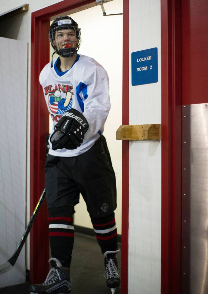 Juneau-Douglas High School senior Dalton Hoy is one of the first players out of the lockerroom prior to the first practice of the on Wednesday morning at Treadwell Arena. (Nolin Ainsworth | Juneau Empire)