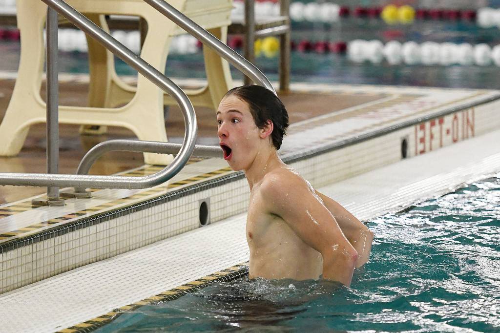 Juneau Douglas senior Cain Hart reacts to a judges scoring on Friday during the Ketchikan Invitational at the Gateway Aquatic Center in Ketchikan. (Dustin Safranek | Ketchikan Daily News)