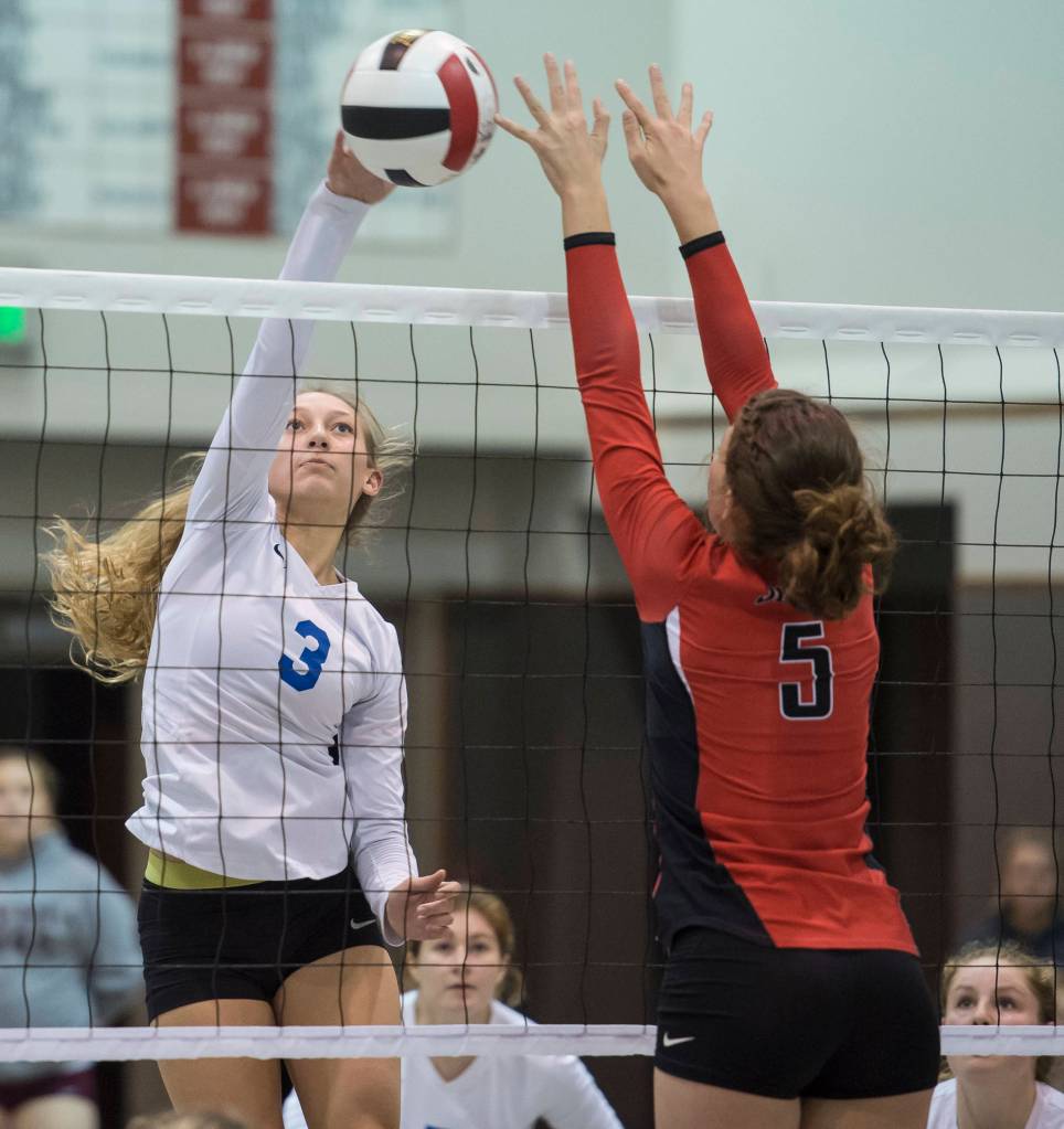 Thunder Mountains Lilyan Smith spikes the ball against Juneau-Douglas JoJo Griggs during the JIVE Tournament at Juneau-Douglas High School on Friday, Oct. 12, 2018.(Michael Penn | Juneau Empire)