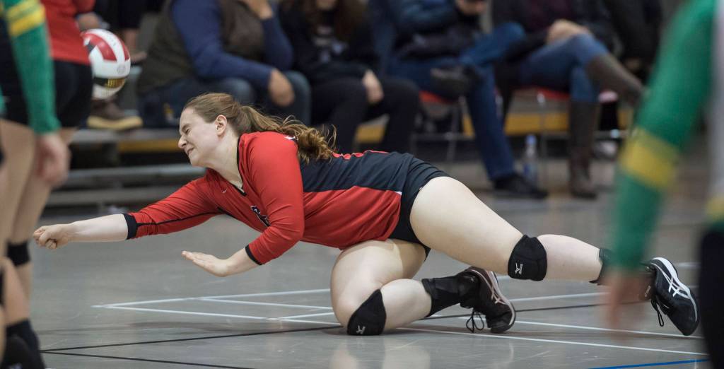 Juneau-Douglas Shaylin Cesar dives for the ball against Craig during the JIVE Tournament at Juneau-Douglas High School on Friday, Oct. 12, 2018. (Michael Penn | Juneau Empire)