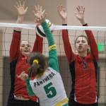 Juneau-Douglas JoJo Griggs, left, and Shaylin Cesar, right, look to block a shot by Craigs Ashley Hansen during the JIVE Tournament at Juneau-Douglas High School on Friday, Oct. 12, 2018. (Michael Penn | Juneau Empire)