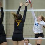 Thunder Mountains Audrey Welling, right, places the ball over Mount Edgecumbes Leticia Skaflestad, center, and Haley Sweet-Cushing during the JIVE Tournament at Juneau-Douglas High School on Friday, Oct. 12, 2018. (Michael Penn | Juneau Empire)