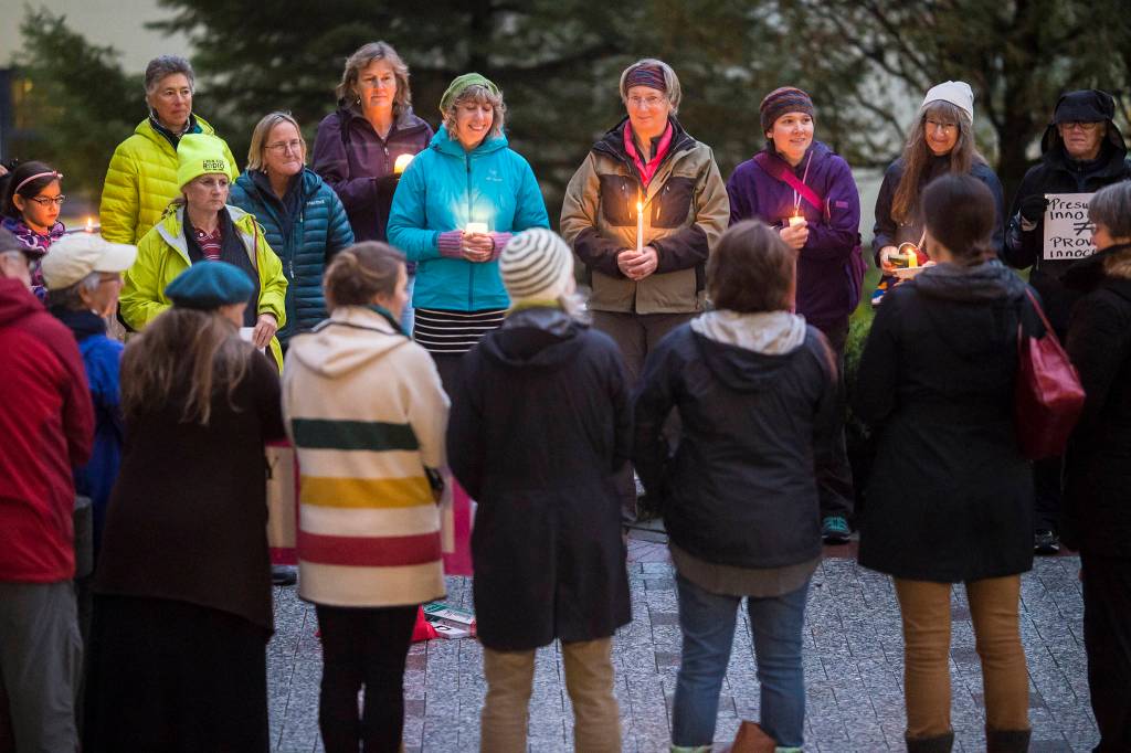 About 50 people gather in front of the Capitol on Friday, Oct. 5, 2018, to hold a vigil in protest of President Donald Trumps Supreme Court Justice nominee Brett Kavanaugh. The gathering was organized by local group called The ReSisters. (Michael Penn | Juneau Empire)
