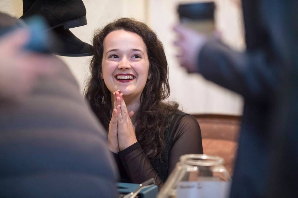 Poet Audrey Kohler interacts with patrons at the Downtown Dames during First Friday on Friday, Oct. 5, 2018. (Michael Penn | Juneau Empire)