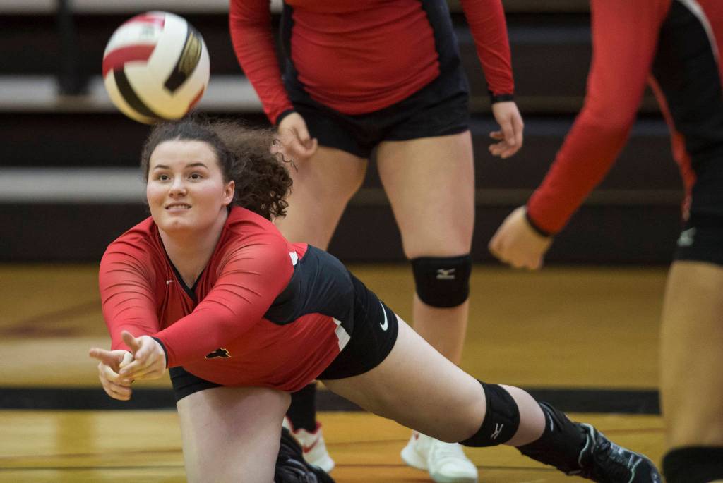 Gabi Griggs dives for the ball against Ketchikan during the JIVE Tournament at Juneau-Douglas High School on Friday, Oct. 12, 2018, (Michael Penn | Juneau Empire)