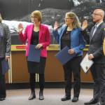 Mayor Beth Weldon, left, Carole Triem, Michelle Bonnet Hale, Wade Bryson and Loren Jones are sworn in to their new positions on the Juneau Assembly on Monday, Oct. 15, 2018. (Michael Penn | Juneau Empire)