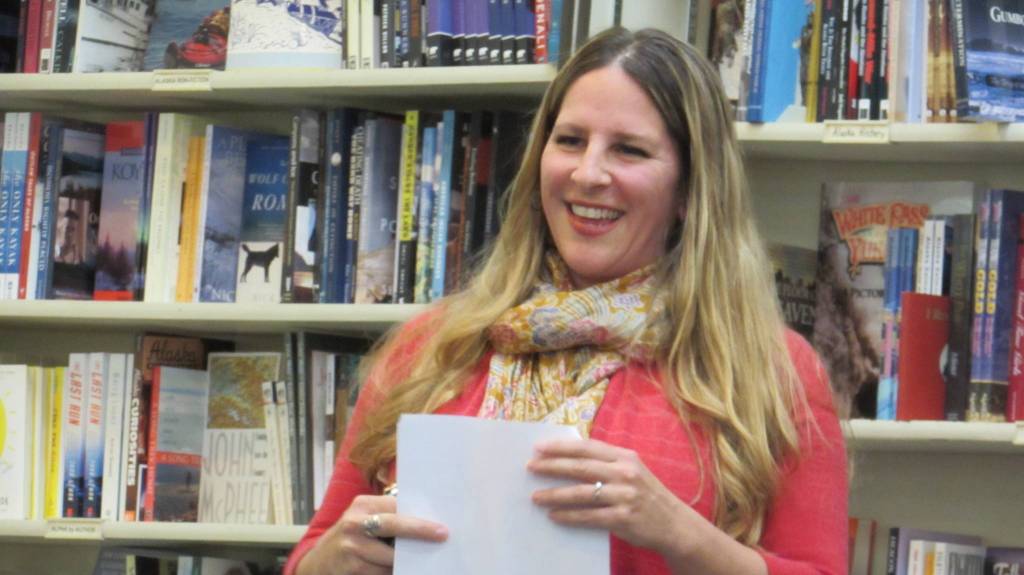 Amy Pinney smiles after reading her poems during an Alaska Women Speak event. (Ben Hohenstatt | Capital City Weekly)