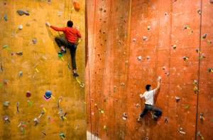 In this 2008 file photo, Nathan Gaudreault, left, and Tyler Gress work their way up The Rock Dumps climbing walls. (Michael Penn | Juneau Empire)