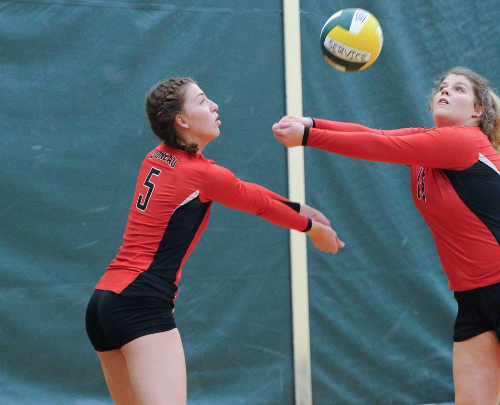 JDHS JoJo Griggs and Skylar Hickok combine for a return. The Crimson Bears lost to the Kardinals 25-19 and 25-22. (Michael Dinneen | For the Juneau Empire)
