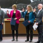 Mayor Beth Weldon, left, Carole Triem, Michelle Bonnet Hale, Wade Bryson and Loren Jones are sworn in to their new positions on the Juneau Assembly on Monday, Oct. 15, 2018. (Michael Penn | Juneau Empire)