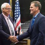 Outgoing Mayor Ken Koelsch, left, thanks Assembly member Jerry Nankervis for his service in the Assembly chambers on Monday, Oct. 15, 2018. (Michael Penn | Juneau Empire)