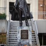 A display of carved pumpkins decorate the base of the William Henry Seward statue at the Dimond Courthouse Plaza on Thursday, Oct. 18, 2018. (Michael Penn | Juneau Empire)