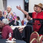 Lillian Hillman, left, watches as Woosh.ji.een Dance Group dancer John Garcia performs during a Celebrate Survivors gathering sponsored by Central Council Tlingit and Haida Indian Tribes of Alaska and AWARE in the Elizabeth Peratrovich Hall on Tuesday, Oct. 23, 2018. October is Domestic Violence Awareness Month. (Michael Penn | Juneau Empire)