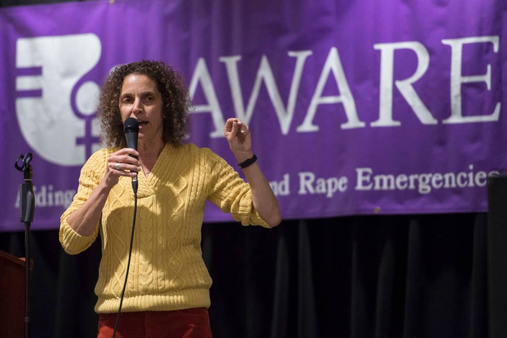 AWARE Executive Director Saralyn Tabachnick welcomes people attending a Celebrate Survivors gathering in the Elizabeth Peratrovich Hall on Tuesday, Oct. 23, 2018. The event is sponsored by Central Council Tlingit and Haida Indian Tribes of Alaska and AWARE. October is Domestic Violence Awareness Month. (Michael Penn | Juneau Empire)