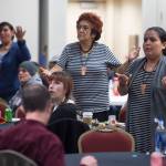 People pay tribute to the Woosh.ji.een Dance Group as they perform during a Celebrate Survivors gathering sponsored by Central Council Tlingit and Haida Indian Tribes of Alaska and AWARE in the Elizabeth Peratrovich Hall on Tuesday, Oct. 23, 2018. October is Domestic Violence Awareness Month. (Michael Penn | Juneau Empire)