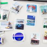 Newly designed stickers by local artist Pat Race wait for voters during early voting at the State Office Building on Monday, Oct. 22, 2018. (Michael Penn | Juneau Empire File)