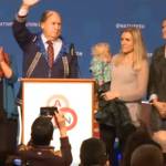 In this screenshot from a video stream provided by the Alaska Federation of Natives, Gov. Bill Walker waves to the crowd on Friday, Oct. 19, 2018 after announcing that he has suspended his bid for re-election and is supporting the Democratic candidate, Mark Begich. (Screenshot)