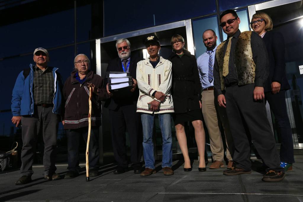 Eduard Zdor, Russia, former director of the Chukotka Marine Mammal Hunters Association; George Edwardson, board member for Inuit Circumpolar Council-Alaska and President of the Inupiat Community of the Arctic Slope (ICAS); Tom Strang, Senior Vice President of Maritime Affairs for Carnival Corporation; Delbert Pungowiyi, Alaska, President of Native Village of Savoonga (on St. Lawrence Island near the Bering Strait); Kendra Ulrich, Senior Shipping Campaigner for Stand.earth; DJ Tyson, Arctic Program Specialist for Pacific Environment; Verner Wilson, Friends of the Earth, formerly of Bristol Bay Native Association and member of Curyung Tribal Council; Dr. Lucy Gilliam, Aviation and Shipping Officer stand in front of the UK HQ for cruise industry giant, Carnival Corporation. The Arctic Indigenous and eNGO representatives of the Clean Up Carnival Coalition met with Carnival executives to deliver an international petition signed by over 104,000 concerned people from countries across Europe and North America calling on the company to end its use of ultra-dirty heavy fuel oil, starting with its ships traveling to the fragile Arctic and Subarctic regions. (Courtesy Photo | Jiri Rezac via Stand.earth)