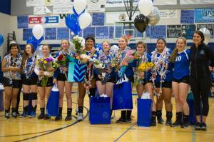 Thunder Mountain High School seniors gather for a picture prior to their last home game of the season against Juneau-Douglas on Friday night at TMHS. (Left to right): Kellie James, Tara Dymock, Leilani Eshnaur, Hannah Harvey, Kyra Jenkins Hayes, Sydney Lee, Alex Murray, Kiley Stevens, Marissa Tanuvasa-Tuvaifale, Audrey Welling, Coach Julie Herman. (Nolin Ainsworth | Juneau Empire)