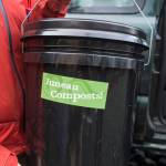 Lisa Daugherty, owner of Juneau Composts!, holds one of her residential buckets to hold food scraps on Wednesday, Oct. 24, 2018. Daugherty currently picks up compost from 140 homes. (Michael Penn | Juneau Empire)