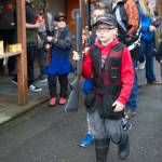 Tucker Gibson, 8, of Petersburgs Devils Club Shooters, walks out of the Juneau Gun Club toward the range during the fourth annual Southeast Fall Shoot Tournament on Saturday. The Devils Club Shooters brought eight youth to the two-day event. (Nolin Ainsworth | Juneau Empire)