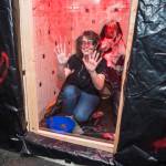 Juneau residents react to scares and chills as they make their way through the Haunted Station at the U.S. Coast Guards Station Juneau on Friday, Oct. 26, 2018. Station personnel pay for all the decoration themselves and take three weeks to ready the station. Entry is non perishable food items for the Southeast Alaska Food Bank. (Michael Penn | Juneau Empire)