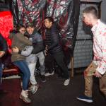Juneau residents react to scares and chills as they make their way through the Haunted Station at the U.S. Coast Guards Station Juneau on Friday, Oct. 26, 2018. Station personnel pay for all the decoration themselves and take three weeks to ready the station. Entry is non perishable food items for the Southeast Alaska Food Bank. (Michael Penn | Juneau Empire)