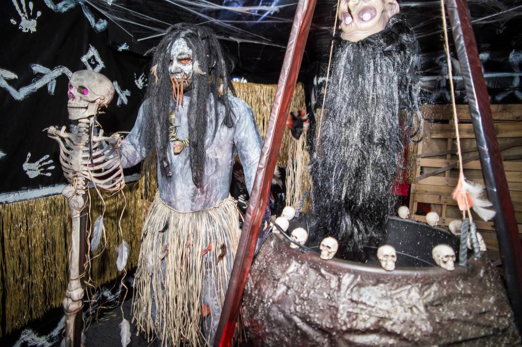 Juneau residents react to scares and chills as they make their way through the Haunted Station at the U.S. Coast Guards Station Juneau on Friday, Oct. 26, 2018. Station personnel pay for all the decoration themselves and take three weeks to ready the station. Entry is non perishable food items for the Southeast Alaska Food Bank. (Michael Penn | Juneau Empire)