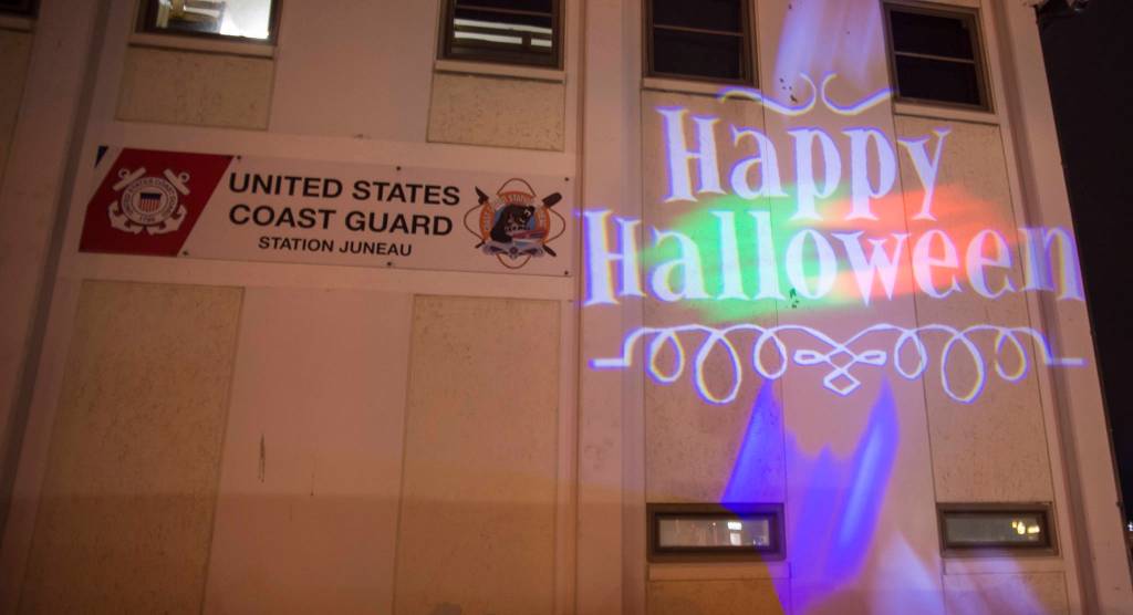 Juneau residents react to scares and chills as they make their way through the Haunted Station at the U.S. Coast Guards Station Juneau on Friday, Oct. 26, 2018. Station personnel pay for all the decoration themselves and take three weeks to ready the station. Entry is non perishable food items for the Southeast Alaska Food Bank. (Michael Penn | Juneau Empire)