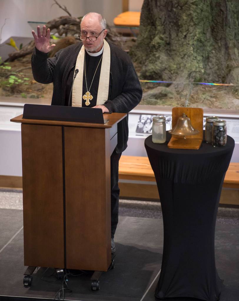 The Reverend Gordon Blue, of The Church of the Holy Trinity, gives a prayer during a Centennial Commemoration Ceremony at the Father Andrew P. Kashevaroff Building on Thursday, Oct. 25, 2018, on the 100th anniversary of the sinking of the S.S. Princess Sophia. (Michael Penn | Juneau Empire)