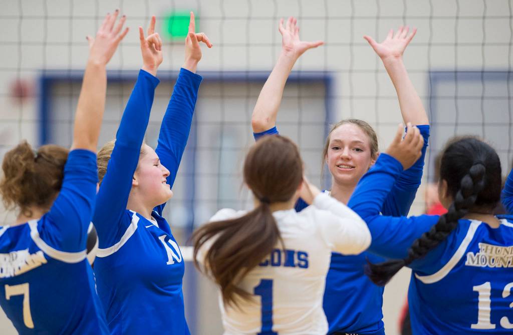 Thunder Mountain celebrates a point against Juneau-Douglas at TMHS on Friday, Oct. 26, 2018. (Michael Penn | Juneau Empire