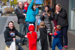 Parents, grandparents and friends have fun photographing their young ones on Seward Street for Halloween on Monday, October 31, 2016. (Michael Penn | Juneau Empire File)