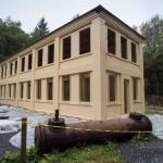 The New Office Building at the Treadwell Mine Historic Area, shown on Thursday, Oct. 11, 2018, has received a new metal roof and a fresh coat of paint inside and out. (Michael Penn | Juneau Empire)