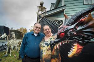 Will and Mindy Jones pose with some of their many Halloween decorations at their home at the corner of 10th Street and Glacier Avenue on Tuesday, Oct. 30, 2018. The Jones have been decorating their home for the last 14 years and expect to nearly 400 visitors this year. Mindy said, If you dont like spiders, this isnt the place for you. (Michael Penn | Juneau Empire)
